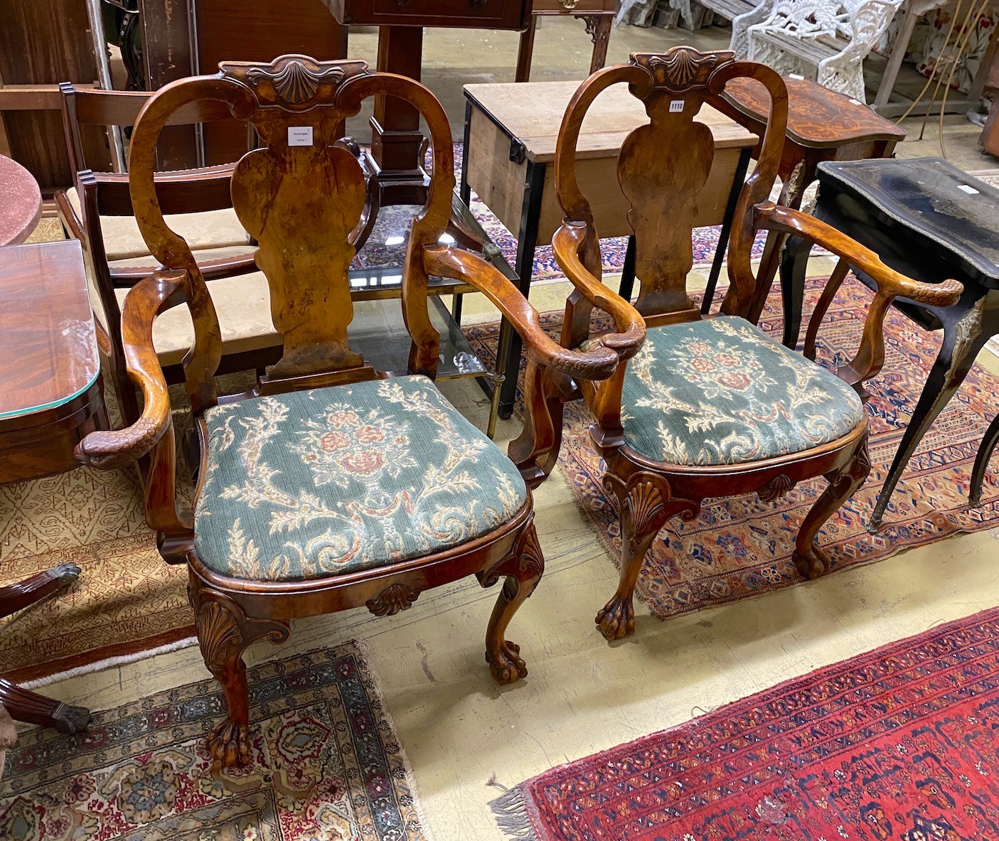 A pair of Queen Anne revival walnut elbow chairs with eagle head carved arms, width 82cm, depth 48cm, height 103cm